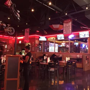 a woman standing in a restaurant