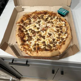 Large sausage with extra cheese hand tossed.