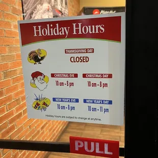 a holiday hours closed sign