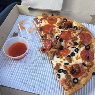 two slices of pizza in a box