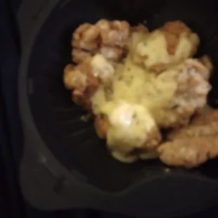 a plate of food with chicken and cheese