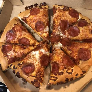 a pepperoni pizza in a box