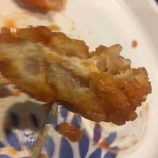 a piece of pizza on a fork