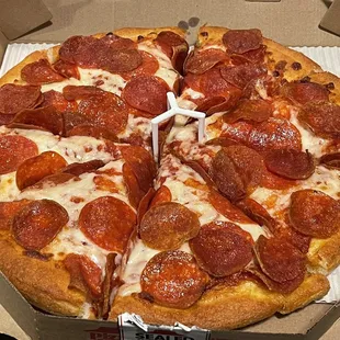 a pepperoni pizza in a box