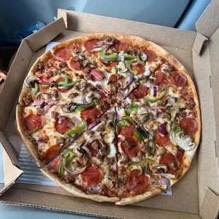 Yummy thin-crust supreme pizza!