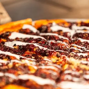 a close up of a pizza with toppings