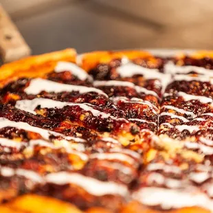 a close up of a pizza with toppings