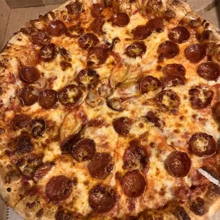 a pepperoni pizza in a box