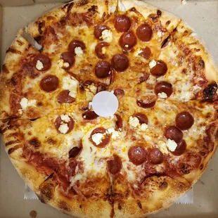 a pepperoni pizza in a box