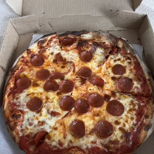 a pepperoni pizza in a box