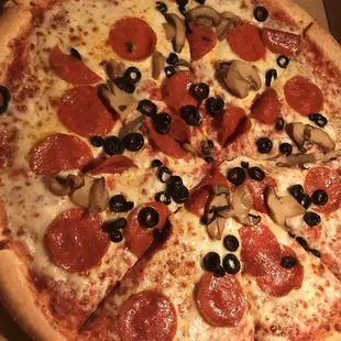 Way skimpy toppings on this mushroom, black olives and pepperoni pie.