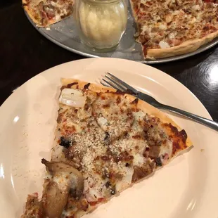 a slice of pizza on a plate