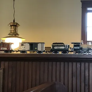 The dining area is decorated with a train theme.