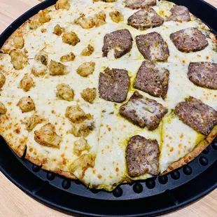 Half coconut shrimp, half lamb meatball pizza