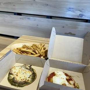 Lamb pizza, chicken kebab pizza and fries