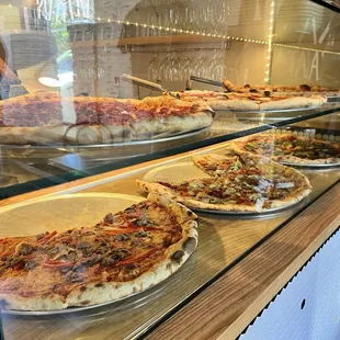 Pizza by the slice at front counter