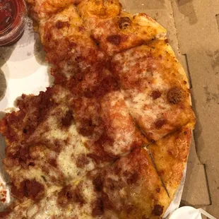 Large pizza with no sauce on 5 of the pieces. And we requested extra sauce on this one.