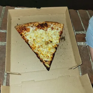 a slice of pizza in a box