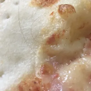Hair in the pizza.