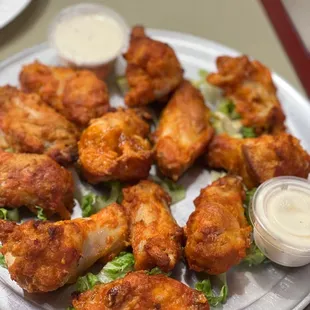 a plate of fried chicken wings