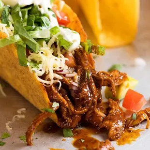 a taco with meat and vegetables