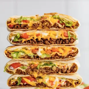 a stack of four tasty looking burritos