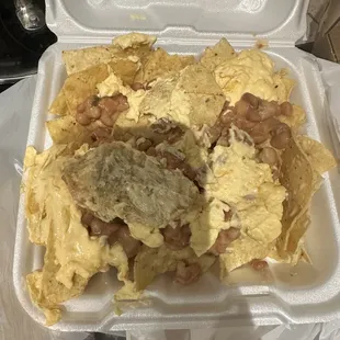 Nachos with cold cheese and NO chicken which I paid for and didn't get!