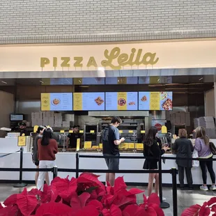 Day before Thanksgiving 2024. Fast service hot food. Big square pizza, slices