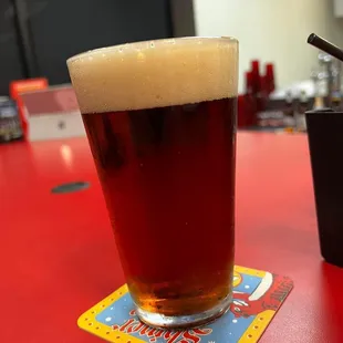 a glass of beer on a table