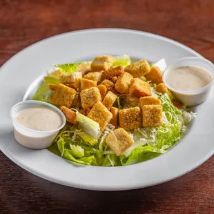 Caesar Salad: romaine, Parmesan, and croutons.