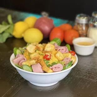 Chef: Romaine, Mixed Greens, Cucumber, Tomatoes, Ham, Cheddar and Croutons. Served with Italian Dressing