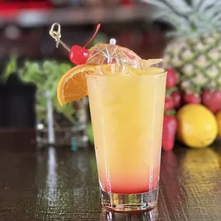 Malibu Rum Sunset: coconut rum, grenadine, orange &amp; pineapple juice