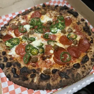 a pepperoni and jalapeno pizza