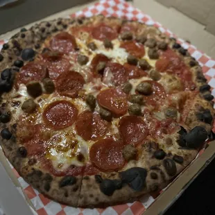 a pepperoni and olive pizza