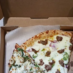 Pizza by the slice to-go. Two slices of the specials of the day.