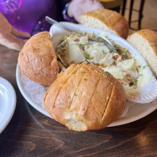 a plate of bread and a bowl of soup