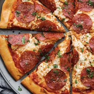 sliced pepperoni pizza on a pan