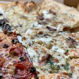 two slices of pizza in a box