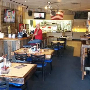 people sitting at tables in a restaurant