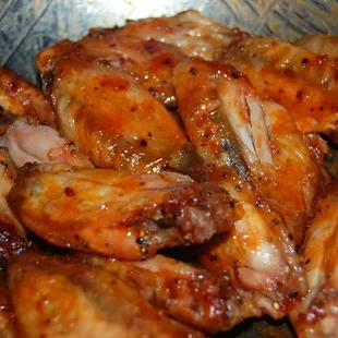 chicken wings in a bowl with sauce