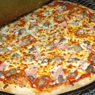 a pizza with meat and cheese