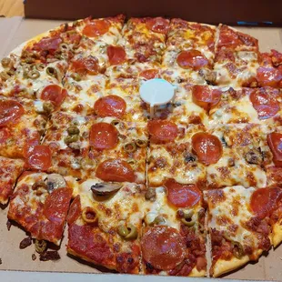 pepperoni, mushrooms, olives, and cheese