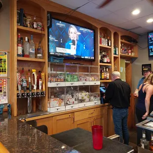 people in a restaurant watching tv