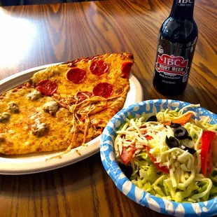 Italian sausage and pepperoni slice. Side salad with provel or provolone cheese. Very nice.