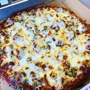 Sausage, pepperoni, canadian bacon, green olives pizza!