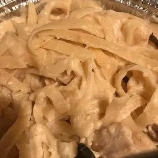 a pan of pasta and meat