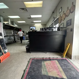 Inside - bench for waiting. No dining space.