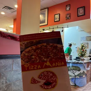 a person holding up a menu