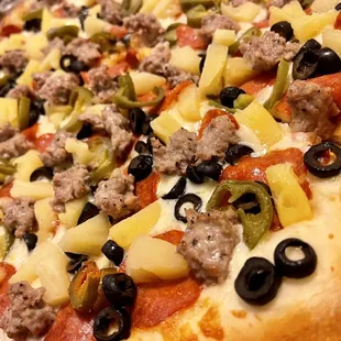Pepperoni, Sausages, Olives, Jalapeños, and Pineapple