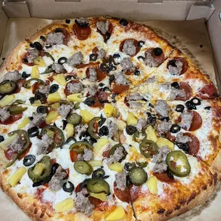 Pepperoni, Italian Sausages, Olives, Jalapeños, and Pineapple